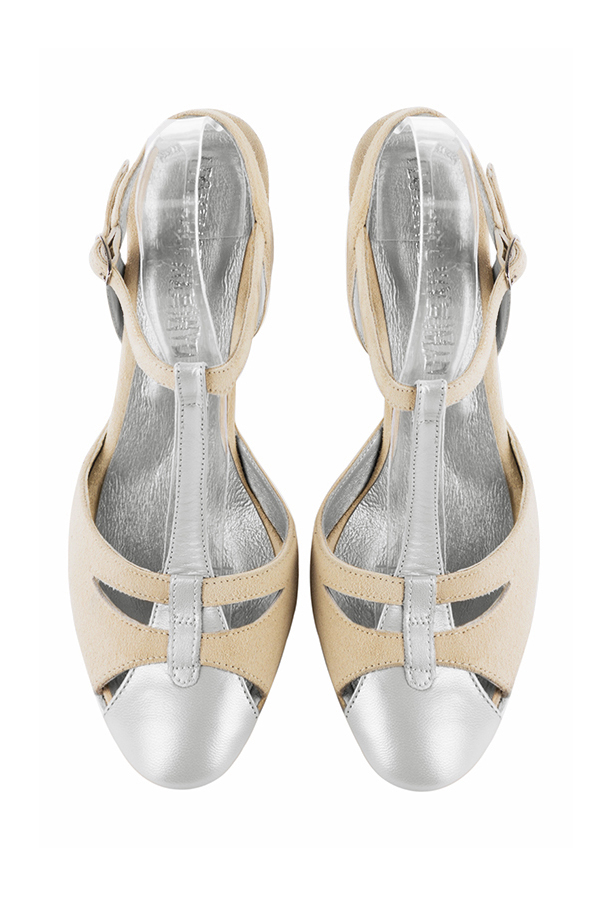 French elegance and refinement for these light silver and champagne white dress open back T-strap shoes, 
                available in many subtle leather and colour combinations. Its comfortable fit will accompany you until the end of the night.
Its charming, playful cutout gives you plenty of customization options.  
                Matching clutches for parties, ceremonies and weddings.   
                You can customize these shoes to perfectly match your tastes or needs, and have a unique model.  
                Choice of leathers, colours, knots and heels. 
                Wide range of materials and shades carefully chosen.  
                Rich collection of flat, low, mid and high heels.  
                Small and large shoe sizes - Florence KOOIJMAN